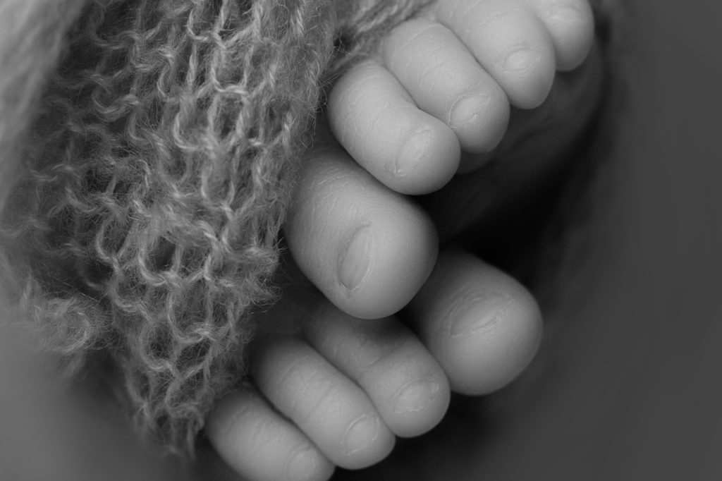 Macro photography of newborn baby's toes