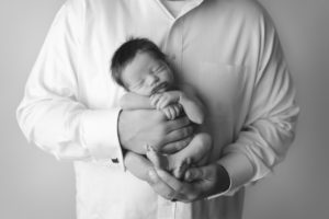 Colorado father holds newborn son
