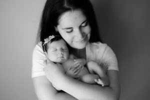 mother and baby in newborn studio